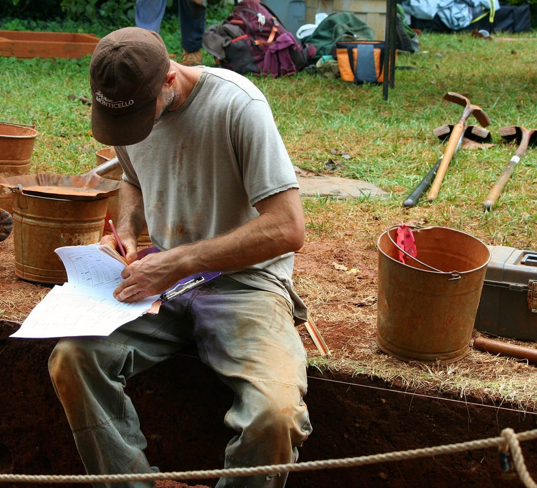 An archaeologist is recording survey data